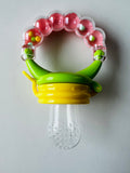 Fruit soother with rattle