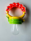 Fruit soother with rattle